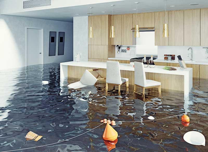 A residential kitchen flooded with water, showcasing the urgent need for professional water damage restoration services in Atlanta
